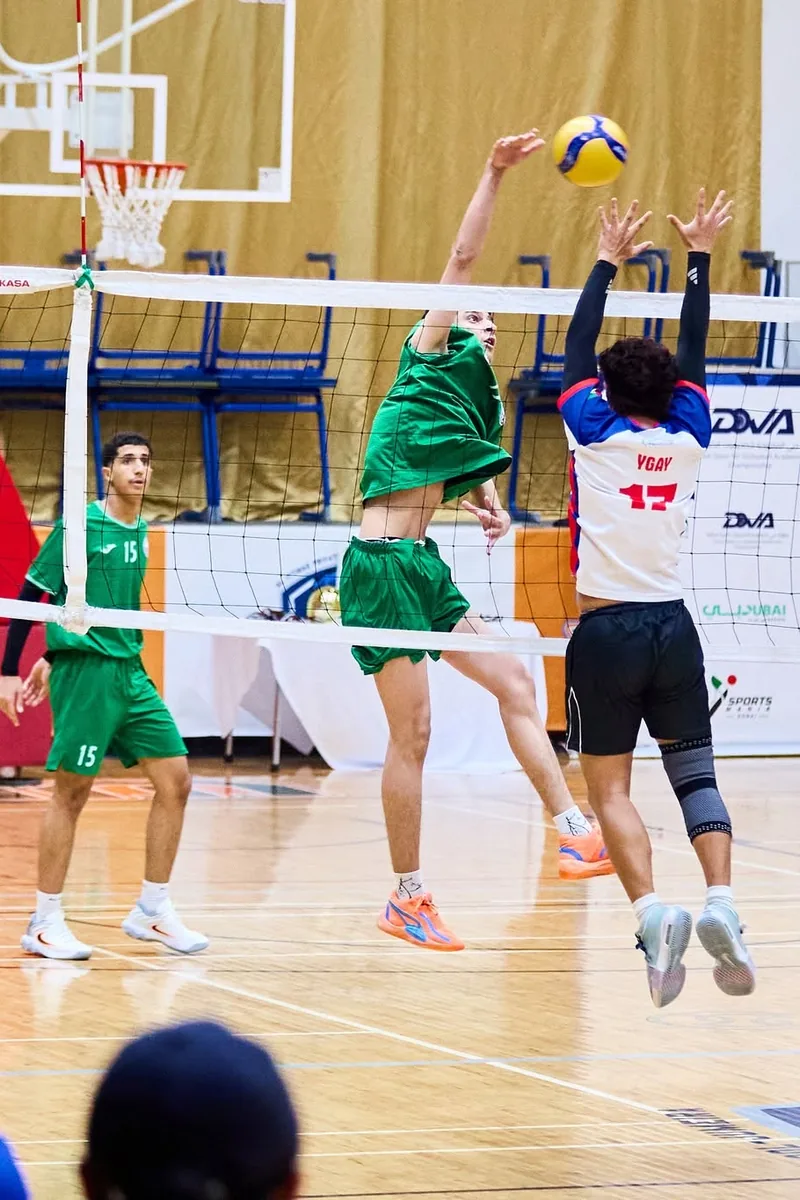 A DOVA player attacking over the net
